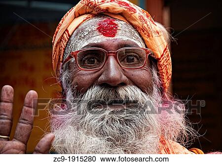 Stock Image - Sadhu saying hello, Varanasi, Benares, Uttar Pradesh, India. Fotosearch