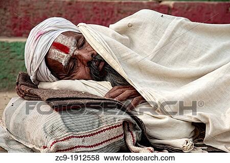 Sadhu sleeping on a ghat Varanasi, Benares, Uttar Pradesh, India View Large Photo Image Stock Photo - Sadhu sleeping on a ghat Varanasi, Benares, Uttar Pradesh, India. Fotosearch