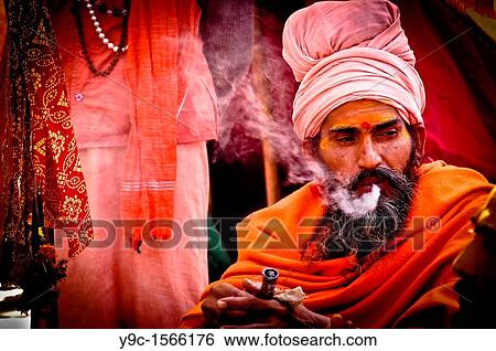 Sadhu Smoking at Kumbha mela, Haridwar, Uttrakhand, India View Large Photo Image Stock Photograph - Sadhu Smoking at Kumbha mela, Haridwar, Uttrakhand, India. Fotosearch