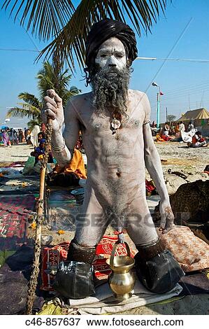 Sadhus gathering for bathing at the confluence of the river Ganges and the Bay of Bengal. Sagar Mela. Ganges River. India. View Large Photo Image Stock Photo - Sadhus gathering for bathing at the confluence of the river Ganges and the Bay of Bengal. Sagar Mela. Ganges River. India.. Fotosearch