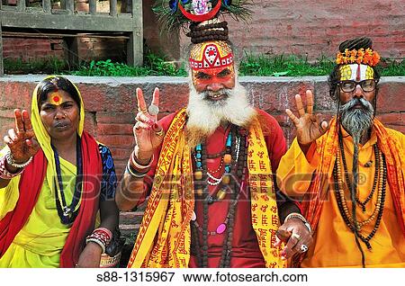 Sadhus professionally posing to the camera all day long at Durbar Square View Large Photo Image Stock Photo - Sadhus professionally posing to the camera all day long at Durbar Square. Fotosearch