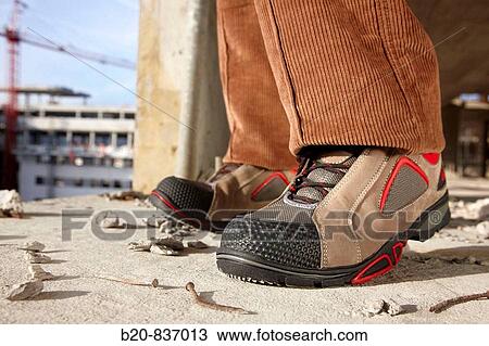 Safety boots, housing construction, construction site View Large Photo Image Stock Image - Safety boots, housing construction, construction site. Fotosearch