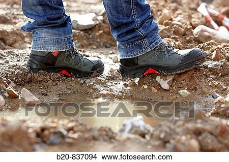 Safety boots, urbanization work View Large Photo Image Picture - Safety boots, urbanization work. Fotosearch