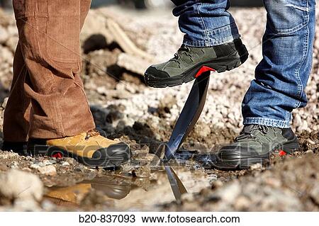 Safety boots, urbanization work View Large Photo Image Stock Image - Safety boots, urbanization work. Fotosearch