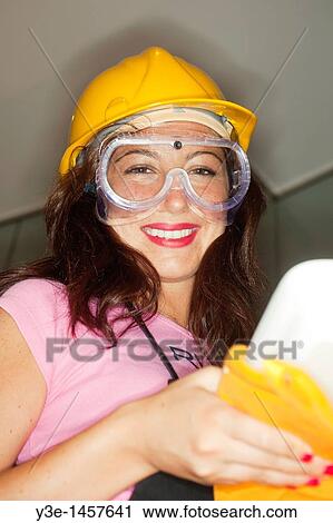 Safety Woman in kitchen Hard hat+ safety goggles/baking tin View Large Photo Image Stock Image - Safety Woman in kitchen Hard hat+ safety goggles/baking tin. Fotosearch