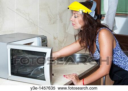 Safety Woman in kitchen Faceshield/microwave View Large Photo Image Stock Photography - Safety Woman in kitchen Faceshield/microwave. Fotosearch