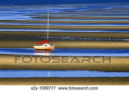 Sailboat anchored in tidal flats, Cape Cod Bay View Large Photo Image Stock Photo - Sailboat anchored in tidal flats, Cape Cod Bay. Fotosearch