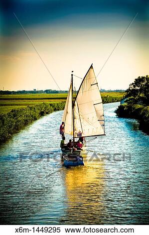 sailboat in a canal near Zaanse Schans Holland, Netherlands, Europe View Large Photo Image Stock Photography - sailboat in a canal near Zaanse Schans Holland, Netherlands, Europe. Fotosearch