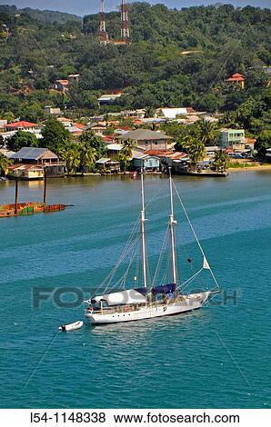 Stock Photo - Sailboat in harbor area Isla Roatan Honduras Central America. Fotosearch