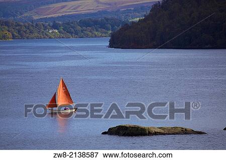 Sailboat on Ullswater near Norfork Island. Lake District, Cumbria, England, United Kingdom. View Large Photo Image Stock Photo - Sailboat on Ullswater near Norfork Island. Lake District, Cumbria, England, United Kingdom.. Fotosearch