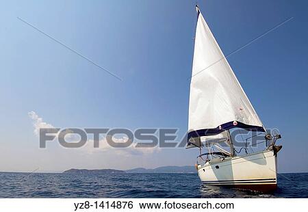 Sailboat view from the sea View Large Photo Image Stock Photograph - Sailboat view from the sea. Fotosearch