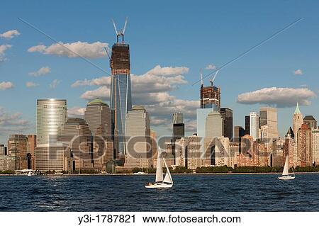 Sailboats catch the breeze on the Hudson River in New York City late on a summer afternoon, with the buildings of the World Financial Center and the World Trade Center complex, including the Freedom Tower One World Trade Center, in the background View Large Photo Image Stock Image - Sailboats catch the breeze on the Hudson River in New York City late on a summer afternoon, with the buildings of the World Financial Center and the World Trade Center complex, including the Freedom Tower One World Trade Center, in the background. Fotosearch
