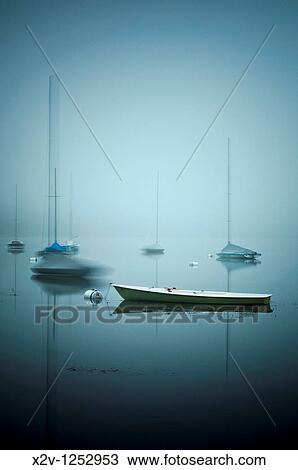 Sailboats on fog shrouded Lake Harriet at dawn View Large Photo Image Stock Image - Sailboats on fog shrouded Lake Harriet at dawn. Fotosearch