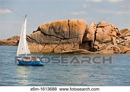 Stock Photo - sailing boat Ploumanach Pink granite coast Perros-Guirec Breton: Perroz-Gireg is a commune in the C? tes-d? Armor department in Bretagne in northwestern France. Fotosearch