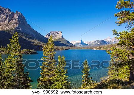 Saint Mary Lake along Going to the Sun Road in Glacier National Park in the Rocky Mountains of Montana View Large Photo Image Stock Image - Saint Mary Lake along Going to the Sun Road in Glacier National Park in the Rocky Mountains of Montana. Fotosearch