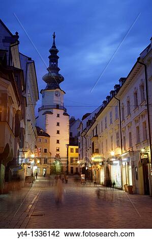 Stock Image - Saint Michaels Tower illuminated at night, Bratislava, Slovakia Built in the 13th century, it remains the only Gothic gateway remaining along the Old City walls. Fotosearch