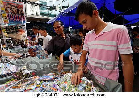Stock Image - Sale of copied DVDs in Bangkok.. Fotosearch