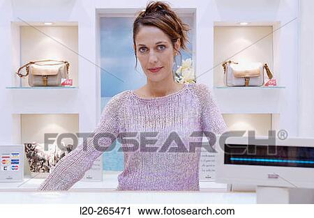Saleswoman in shoe store View Large Photo Image Stock Image - Saleswoman in shoe store. Fotosearch