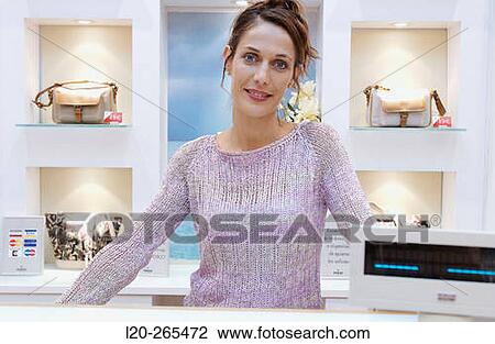 Saleswoman in shoe store View Large Photo Image Stock Image - Saleswoman in shoe store. Fotosearch