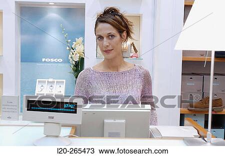 Saleswoman in shoe store View Large Photo Image Stock Image - Saleswoman in shoe store. Fotosearch