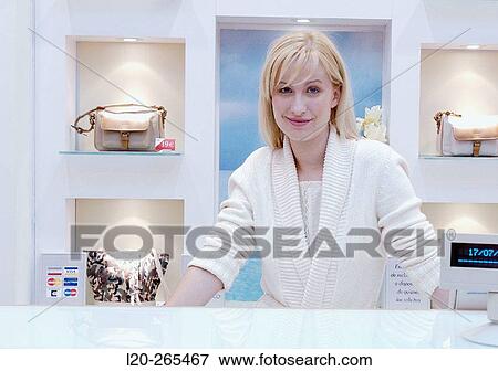 Saleswoman in shopping center View Large Photo Image Stock Photo - Saleswoman in shopping center. Fotosearch