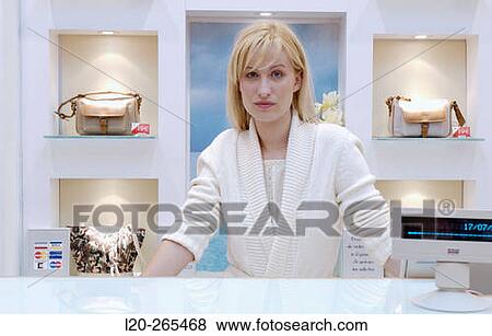 Saleswoman in shopping center View Large Photo Image Stock Photo - Saleswoman in shopping center. Fotosearch