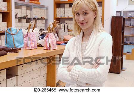 Saleswoman in shopping center View Large Photo Image Stock Photography - Saleswoman in shopping center. Fotosearch