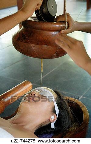 Saligao Goa, India, a woman receiving an ayurvedic massage with oil at the Ayurvedic Natural Health Centre View Large Photo Image Stock Photography - Saligao Goa, India, a woman receiving an ayurvedic massage with oil at the Ayurvedic Natural Health Centre. Fotosearch