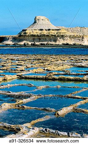 Salted marshes carved in the rock. Gozo island. Malta. View Large Photo Image Picture - Salted marshes carved in the rock. Gozo island. Malta.. Fotosearch