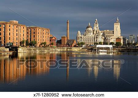Salthouse Dock To the right the three graces of Pier Head the Royal Liver Building, The Cunard Building and the Port of Liverpool Building To the left Albert Dock Buildings Liverpool England UK View Large Photo Image Stock Image - Salthouse Dock To the right the three graces of Pier Head the Royal Liver Building, The Cunard Building and the Port of Liverpool Building To the left Albert Dock Buildings Liverpool England UK. Fotosearch