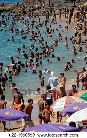 Stock Photo - Salvador de Bahia, Bahia, Brazil, crowd at Praia da Barra. Fotosearch