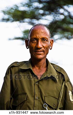 Samburu ranger with ears pierced, Kenya View Large Photo Image Stock Photo - Samburu ranger with ears pierced, Kenya. Fotosearch