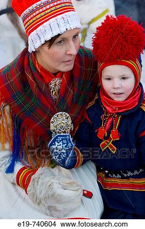 Sami (Lapp) boy with mother at Winter Fair. Jokkmokk, Northern Sweden View Large Photo Image Picture - Sami (Lapp) boy with mother at Winter Fair. Jokkmokk, Northern Sweden. Fotosearch