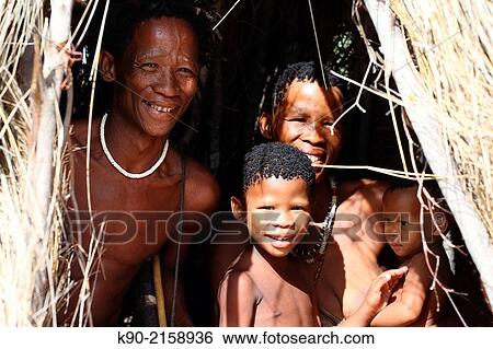 San man with his wife and two kids looking out of his hut, Kalahari Desert, Namibia, Africa. View Large Photo Image Stock Photograph - San man with his wife and two kids looking out of his hut, Kalahari Desert, Namibia, Africa.. Fotosearch