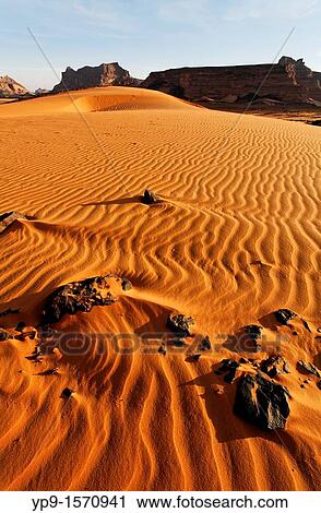 Stock Image - Sand dunes in the Akakus Mountains, Sahara Desert, Libya. Fotosearch
