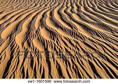 sand ripples, texture on a sand dunes nearTehenadou, Adrar n? Ahnet, Algeria, Sahara, North Africa View Large Photo Image Stock Image - sand ripples, texture on a sand dunes nearTehenadou, Adrar n? Ahnet, Algeria, Sahara, North Africa. Fotosearch