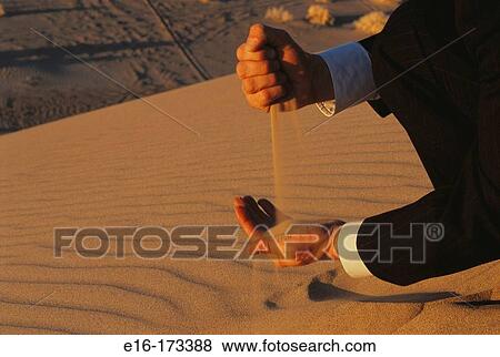 Sand through fingers View Large Photo Image Stock Photo - Sand through fingers. Fotosearch