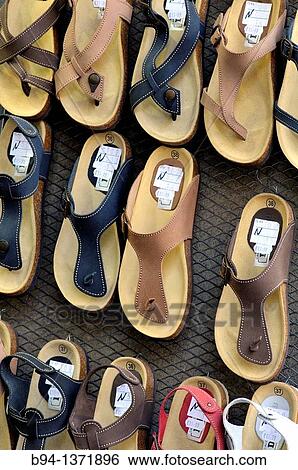 Sandals for sale View Large Photo Image Stock Photograph - Sandals for sale. Fotosearch