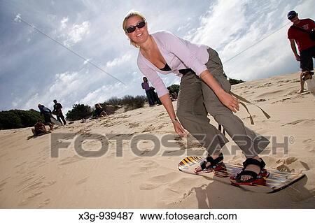 Sandboarding remains a big activity in South Africa View Large Photo Image Stock Photo - Sandboarding remains a big activity in South Africa. Fotosearch