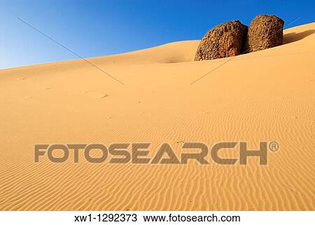 sandstone rock formation at Youf Ahakit, Tassili du Hoggar, Wilaya Tamanrasset, Sahara Desert, Algeria, North Africa View Large Photo Image Stock Image - sandstone rock formation at Youf Ahakit, Tassili du Hoggar, Wilaya Tamanrasset, Sahara Desert, Algeria, North Africa. Fotosearch