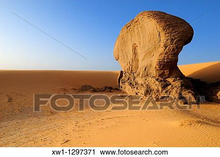 sandstone rock formation at Youf Ahakit, Tassili du Hoggar, Wilaya Tamanrasset, Sahara Desert, Algeria, North Africa View Large Photo Image Stock Image - sandstone rock formation at Youf Ahakit, Tassili du Hoggar, Wilaya Tamanrasset, Sahara Desert, Algeria, North Africa. Fotosearch