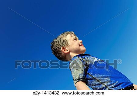Stock Image - Sandy boy at the beach, Ocean City, New Jersey, USA. Fotosearch