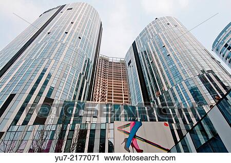 Sanlitun SOHO shopping malls, office and apartment buildings in centre of Sanlitun Area in Chaoyang District, Beijing, China. View Large Photo Image Stock Image - Sanlitun SOHO shopping malls, office and apartment buildings in centre of Sanlitun Area in Chaoyang District, Beijing, China.. Fotosearch