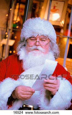 Santa Claus reading wish list View Large Photo Image Picture - Santa Claus reading wish list. Fotosearch