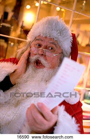 Santa Claus with wish list View Large Photo Image Stock Image - Santa Claus with wish list. Fotosearch