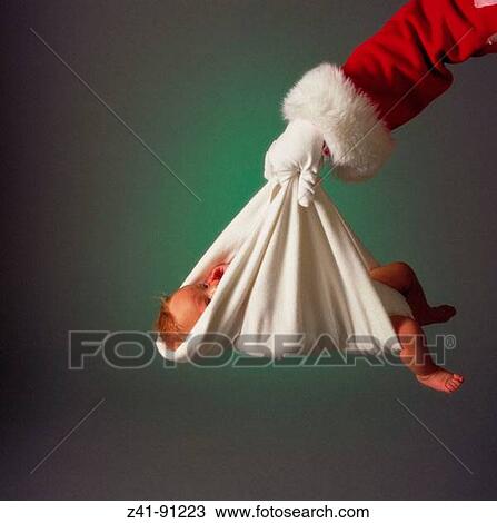 Santa delivering baby View Large Photo Image Stock Image - Santa delivering baby. Fotosearch