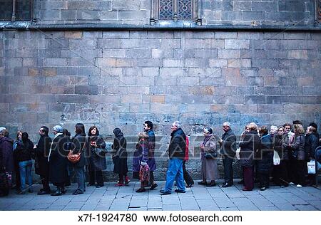 Stock Image - Santa Llucia's day, line to enter at Santa Llucia church, in Carrer Bisbe Barcelona Catalonia, Spain. Fotosearch