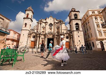 Stock Photo - Santeria woman dancing in front of Cathedral of San Cristobal, Havana Vieja, Old Havana District, Havana, Cuba, West Indies, Central America.. Fotosearch