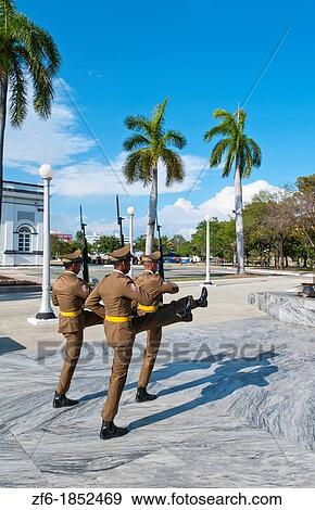 Stock Photo - Santiago Cuba soldiers changing guard at Santa Ifigenia Cemetery and mausoleum of Jose Marti marching. Fotosearch