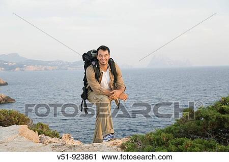 Satisfied man reaching the top View Large Photo Image Stock Image - Satisfied man reaching the top. Fotosearch